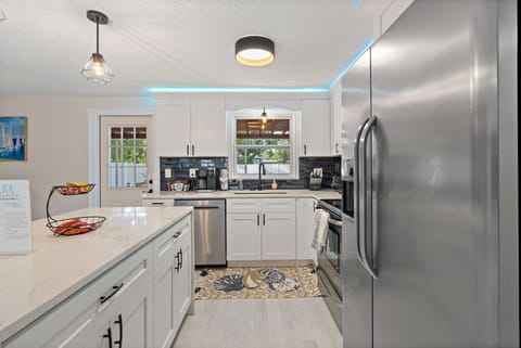 Beautiful remodeled kitchen with quart counter top & all the kitchen amenities.