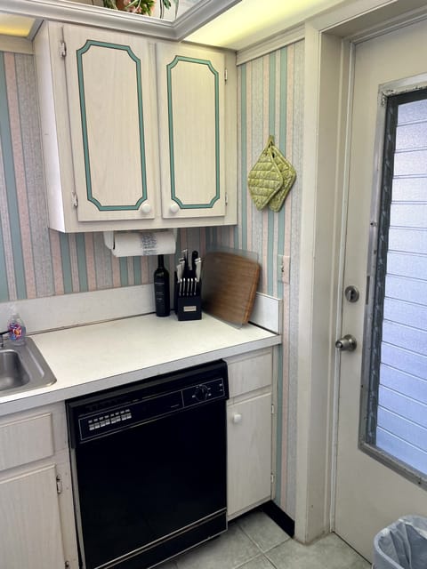 Kitchen with exit into screened in porch.