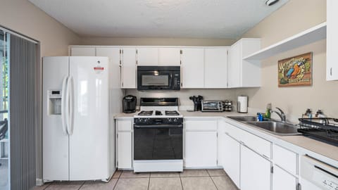 Gas range, spices, utensils, french press, Keurig