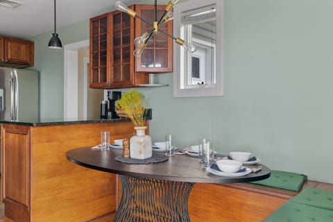 An inviting dining area with cozy banquet seating for five