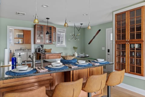 A contemporary kitchen bar with seating for four