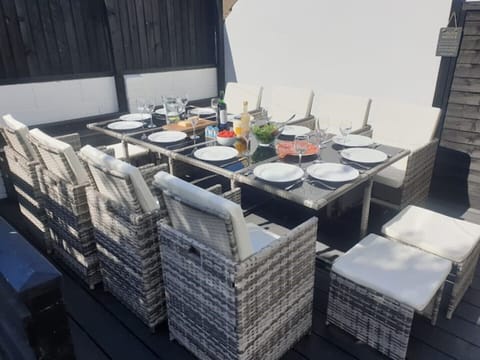 Decked garden area – seats 12. Storage bench with buckets/spades and crab nets.