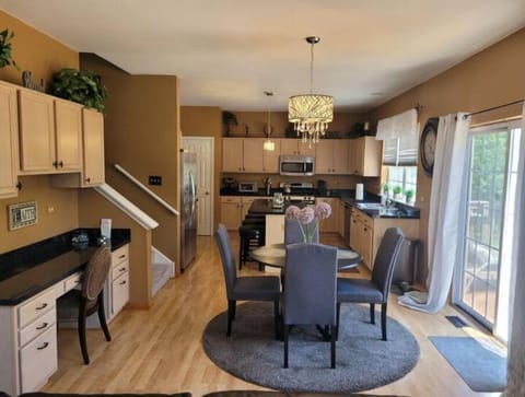 Full Kitchen w SS appliances. Island w 3 seats; table, built in desk.