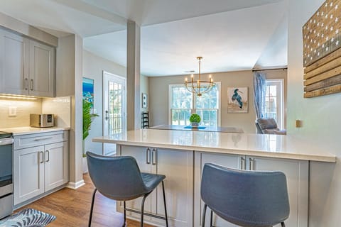 Bar seating between the kitchen and the dining room.