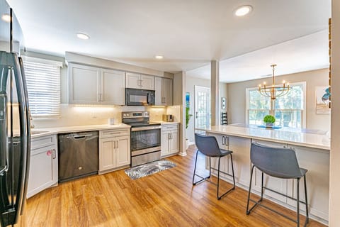 Updated, fully equipped kitchen with bar seating.