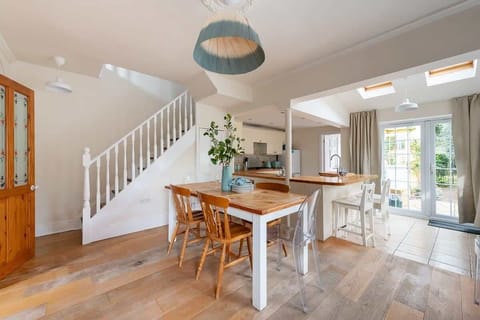 Bright dining room serves as a charming and inviting sanctuary, where loved ones can gather