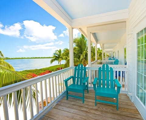 Start mornings on the veranda with sunlit bay panoramas.