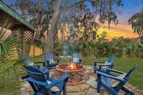 Fire pit area with water view in the main house backyard