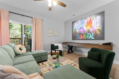 Dive into fun movie nights with plush seating and a vibrant projector screen!