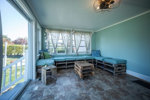 This sun room is just cozy and bright!