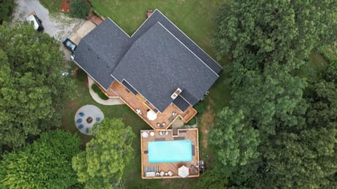 Bird's eye view of the house, pool and firepit shows the privacy you will enjoy
