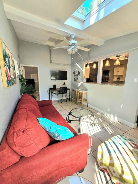 Living area with desk for work area! Also, the natural skylight shining in!