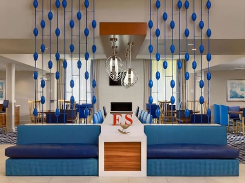 Gather and recharge in a stylish lobby with bold accents.
