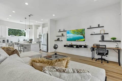 Second Floor Living Room with Large Smart TV with wall art decorations