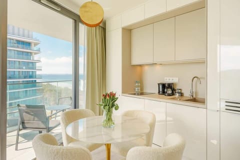 Enjoy your favorite shows on the flat-screen television in the elegant living area.