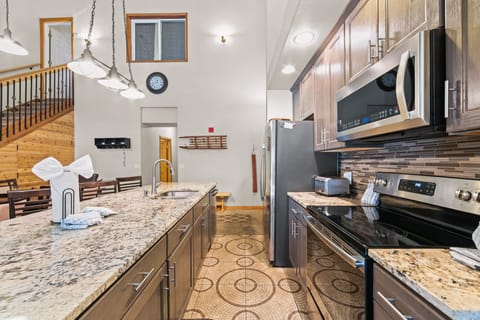 Updated kitchen with granite countertops and stainless steel appliances.