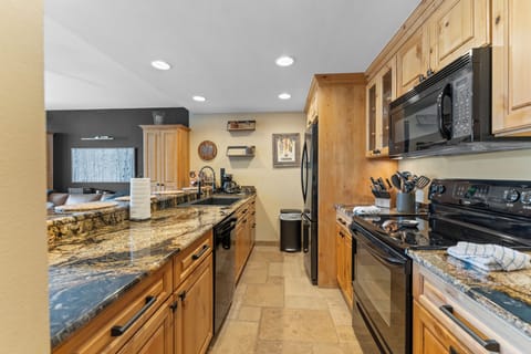 Updated kitchen with granite countertops.