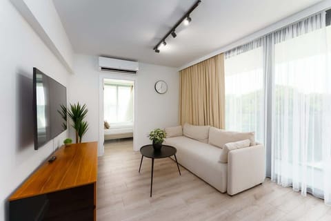 Living room with a comfortable sofa and TV. 