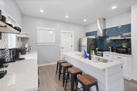 Welcome to our kitchen with a roomy island and seating. It`s fully equipped with everything you need for cooking, from appliances to tools. The perfect place for meal prep and enjoying your favorite dishes.