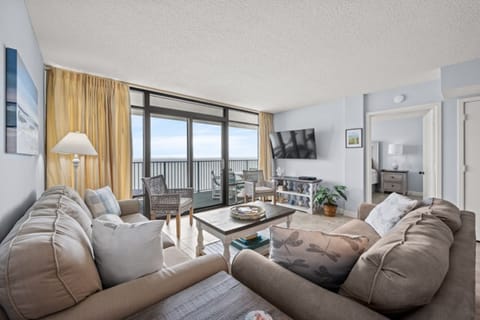 The ocean front living room is well-appointed with comfortable furnishings.