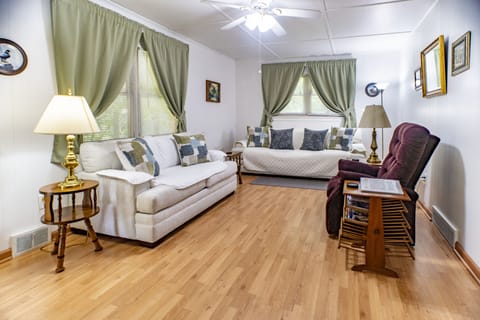 Living room with loveseat, sofa, and recliner
