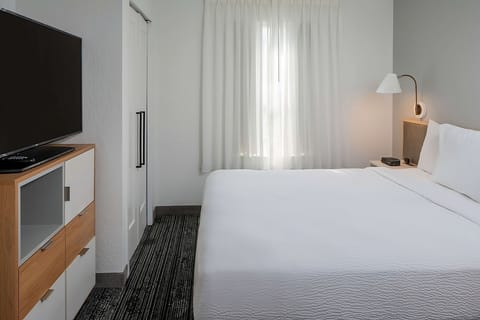 Settle into crisp linens with TV and soft evening lighting