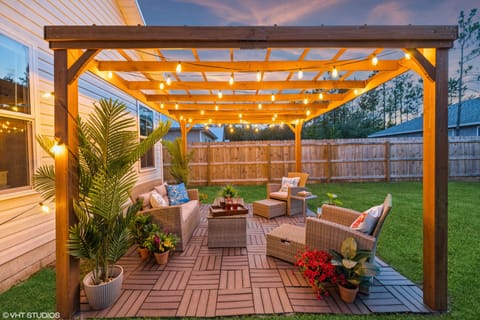 After a long day at the beach, unwind under the pergola with friends and family.