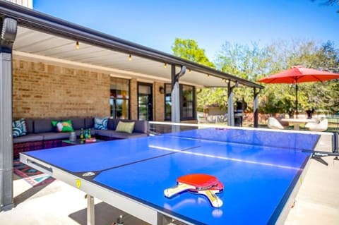 Enjoy ping pong on the expansive back porch with stunning views.