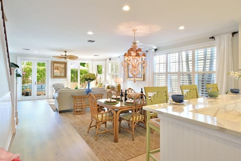 Open format living room, dining area, and kitchen