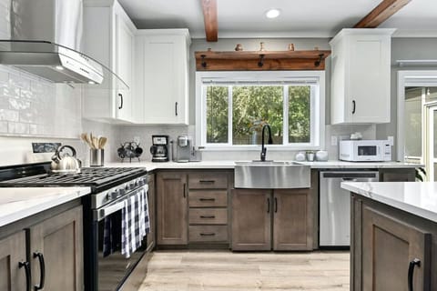 Cook together in a sun-filled kitchen in this Austin vacation rental.
