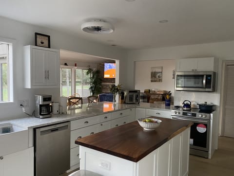 View from kitchen into open DR/FR/LR area 