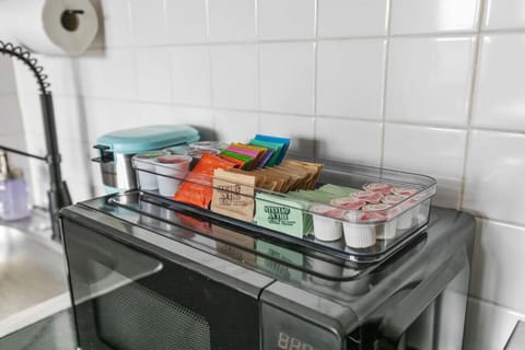 Coffee bar includes all the essentials for your morning brew including a Keurig and a starter set of K-cups, tea, creamer, sugar and stevia. Enjoy!