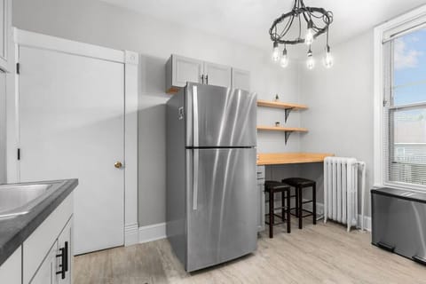 An eating bar and stools are an option if you want a quick bite instead of a sit down meal at the table.