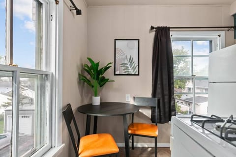 A bistro table for two - enjoy a sit down meal or your morning coffee! Plenty of natural light brightens the space.