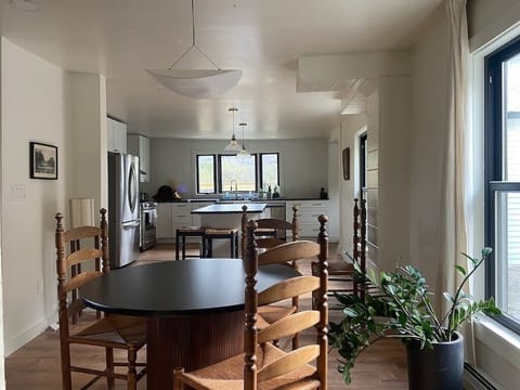 The open-concept living area connects seamlessly to the dining and kitchen spaces — perfect for group stays.