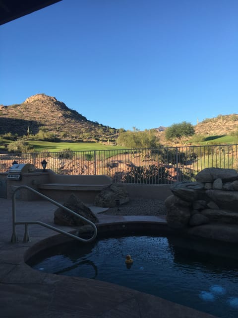Backyard overlooks hole #15 of Dinosaur Golf Course