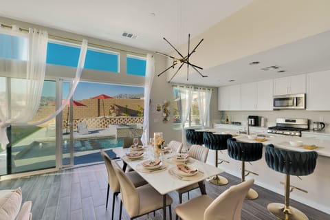 Dining for 6 at the table, counter stools for 4