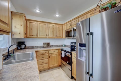 Eating in is no problem with this standard galley kitchen stocked with all your basic needs.