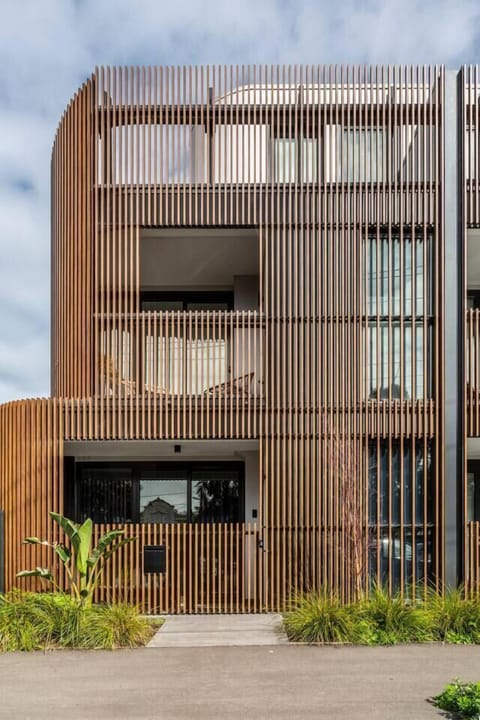 Crafted by visionary architects, this residence showcases an innovative design that seamlessly merges luxurious interiors with an array of outdoor sanctuaries, including a spacious backyard and balconies.