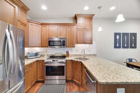 Updated kitchen with modern appliances, massive counter, all cooking supplies