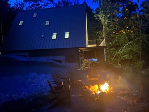 Outdoor fire pit with 4 Pollywood Adirondacks