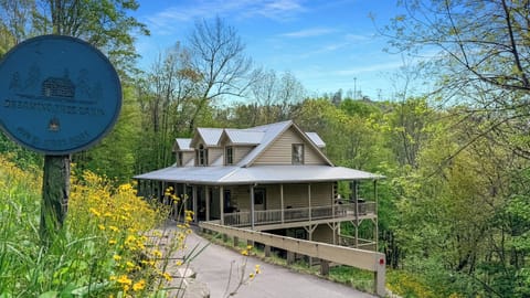 Escape to Dreaming Tree Cabin—nestled in the heart of nature in Wolf Laurel! Surrounded by wildflowers and forest, this charming retreat offers a peaceful oasis, wraparound porches, and borders Hatley Pointe Ski Resort.