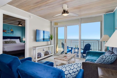 Embrace the ultimate beachside escape in this bright and airy living space featuring modern comforts and breathtaking ocean views from your private balcony. Relax in style with plush seating, a flat-screen TV, and the soothing sound of waves.