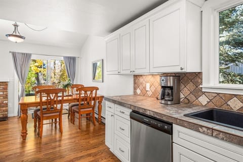 Open-concept kitchen/dining area with a glass door to your spacious back yard.