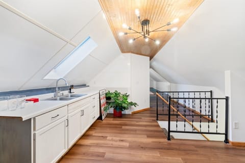 Loft style area in the beverage area with chandelier