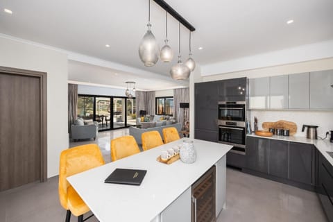 Open-plan living room with sofas, dining area, kitchen, A/C, WiFi internet, satellite TV, and sea views