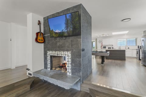 Smart TV by fireplace.
