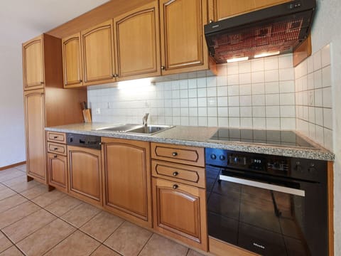 Cabinetry, Furniture, Countertop, Property, Building, Kitchen Stove, Kitchen Appliance, Kitchen, Wood, Drawer