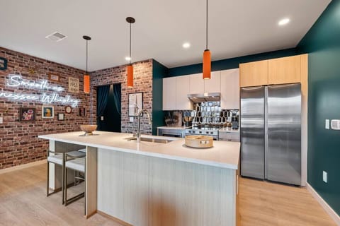 Fully-equipped kitchen with breakfast bar seating. Stocked with all necessary appliances, utensils, spices and more for cooking gourmet meal or making drinks.