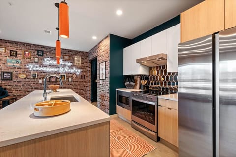 Fully-equipped kitchen with breakfast bar seating. Stocked with all necessary appliances, utensils, spices and more for cooking gourmet meal or making drinks.